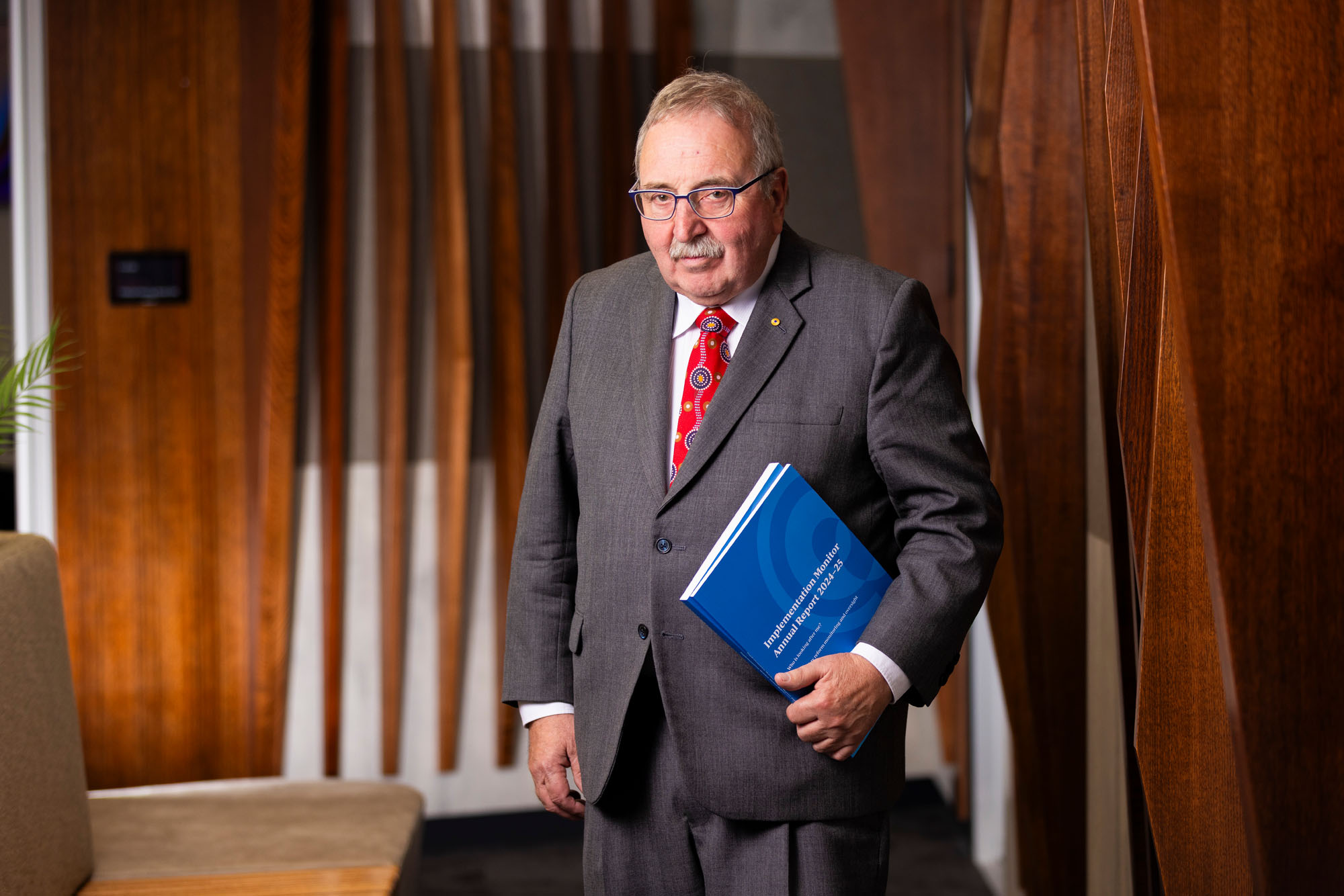 man in suit with report
